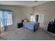 Spacious bedroom with large windows and neutral carpet at 35 Charleston Ln, Covington, GA 30016