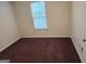 A bedroom with carpet flooring and natural light from a window at 2337 Carousel Park Dr, Morrow, GA 30260