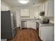 Well-lit kitchen features stainless steel appliances, white cabinetry, and granite countertops at 2337 Carousel Park Dr, Morrow, GA 30260