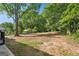 A large lot with mature trees and partially cleared area for building, gardening or entertaining at 264 Rockin Hill Sw Dr, Marietta, GA 30060