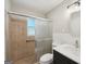 Bathroom featuring a tile shower with glass doors and modern vanity at 264 Rockin Hill Sw Dr, Marietta, GA 30060