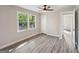 A bright bedroom features gray wood-look flooring and a large window at 264 Rockin Hill Sw Dr, Marietta, GA 30060