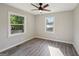 A bright bedroom with gray wood-look flooring and lots of natural light at 264 Rockin Hill Sw Dr, Marietta, GA 30060