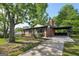 Single-story brick home featuring a covered carport and long concrete driveway at 264 Rockin Hill Sw Dr, Marietta, GA 30060