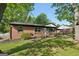 Cozy brick home with well-kept lawn, mature trees and a covered porch at 264 Rockin Hill Sw Dr, Marietta, GA 30060