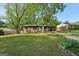 Charming brick home with a well-maintained front yard and covered parking at 264 Rockin Hill Sw Dr, Marietta, GA 30060