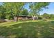 Charming brick home with a well-maintained front yard and mature trees at 264 Rockin Hill Sw Dr, Marietta, GA 30060