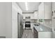 Bright kitchen has white cabinetry, stainless appliances, and modern countertops at 264 Rockin Hill Sw Dr, Marietta, GA 30060