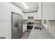 Bright kitchen has white cabinetry, stainless appliances, and modern countertops at 264 Rockin Hill Sw Dr, Marietta, GA 30060