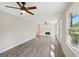 Spacious living room featuring wood floors, brick fireplace, and large windows at 264 Rockin Hill Sw Dr, Marietta, GA 30060