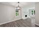 Bright living room features a painted brick fireplace and updated lighting fixture at 264 Rockin Hill Sw Dr, Marietta, GA 30060