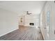 Bright living room with a brick fireplace, hardwood floors, and neutral paint at 264 Rockin Hill Sw Dr, Marietta, GA 30060