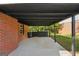 Covered patio with concrete floor and access to the backyard, offering a great space for outdoor entertaining at 264 Rockin Hill Sw Dr, Marietta, GA 30060