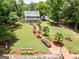 Aerial view of the home with the landscaped path to the lake and private boat dock at 270 Polk Rd, Covington, GA 30014