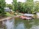 Aerial view of the home with a private beach and dock on the lake at 270 Polk Rd, Covington, GA 30014