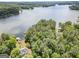 Aerial view highlighting a lakeside property with a private dock, lush surroundings, and serene setting, perfect for relaxation at 270 Polk Rd, Covington, GA 30014