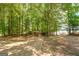 Backyard area with a volleyball net, seating and a view of the lake at 270 Polk Rd, Covington, GA 30014