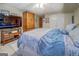 This bedroom features light tile floors, a wardrobe, and a bed with blue and white bedding at 270 Polk Rd, Covington, GA 30014