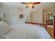 Bright bedroom featuring a clean white comforter, wood-framed bed, and multiple closets for ample storage at 270 Polk Rd, Covington, GA 30014