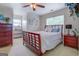 Inviting bedroom with a classic wood frame bed, complemented by matching dressers and soft, natural light at 270 Polk Rd, Covington, GA 30014