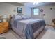 Cozy bedroom featuring neutral tones, ceiling fan, a comfortable bed, and soft lighting, creating a relaxing retreat at 270 Polk Rd, Covington, GA 30014