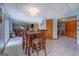 Open concept dining and living area with wood table and chairs and comfortable living room furniture at 270 Polk Rd, Covington, GA 30014