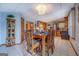 Open dining area featuring tile flooring, wooden furniture, and a clear view into the kitchen, creating an inviting space at 270 Polk Rd, Covington, GA 30014