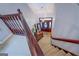 Staircase leading to the entryway with a dark wood door and decorative glass at 270 Polk Rd, Covington, GA 30014