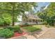 Inviting home with a charming front porch, well-maintained landscaping, and lake view at 270 Polk Rd, Covington, GA 30014