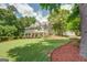 Screened-in porch and patio overlooking a big yard and wooded lot at 270 Polk Rd, Covington, GA 30014