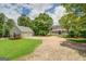 Charming home featuring a long front porch, well-manicured lawn, and a detached two-car garage at 270 Polk Rd, Covington, GA 30014