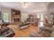 Spacious living room features a stone fireplace, hardwood floors, and comfortable leather furniture at 270 Polk Rd, Covington, GA 30014