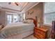 The main bedroom features hardwood floors, natural light, a ceiling fan, and neutral walls at 270 Polk Rd, Covington, GA 30014
