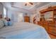 The main bedroom features hardwood floors, natural light, a ceiling fan, and access to the ensuite bathroom at 270 Polk Rd, Covington, GA 30014