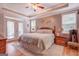 The main bedroom features hardwood floors, natural light, a ceiling fan, and neutral walls at 270 Polk Rd, Covington, GA 30014