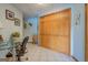 Functional home office space with tile flooring, a glass desk, and a wooden closet, ideal for remote work or study at 270 Polk Rd, Covington, GA 30014