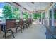 Spacious covered patio with bar seating and a lake view, ideal for outdoor dining and relaxation at 270 Polk Rd, Covington, GA 30014