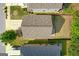 A top-down aerial view of house with roof, driveway, yard, and surrounding trees and homes at 11755 Lovejoy Crossing Blvd, Hampton, GA 30228