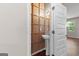 Stylish half-bathroom featuring a pedestal sink and decorative wall paneling at 11755 Lovejoy Crossing Blvd, Hampton, GA 30228
