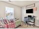 This bedroom features a daybed, a desk with a computer, and a large window that lets in plenty of natural light at 11755 Lovejoy Crossing Blvd, Hampton, GA 30228