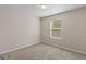 Comfortable bedroom with plush carpet, neutral walls, and natural light at 11755 Lovejoy Crossing Blvd, Hampton, GA 30228