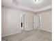 Large bedroom with trey ceiling, plush carpet, and multiple doorway access points at 11755 Lovejoy Crossing Blvd, Hampton, GA 30228