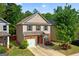 Charming two-story home featuring a brick facade, well-maintained landscaping, and a single-car garage at 11755 Lovejoy Crossing Blvd, Hampton, GA 30228