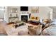 A stylish living room featuring a fireplace, modern coffee table, and comfortable seating arrangements at 11755 Lovejoy Crossing Blvd, Hampton, GA 30228