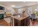 Open-concept living room and kitchen area, featuring a fireplace and access to the dining room at 11755 Lovejoy Crossing Blvd, Hampton, GA 30228