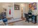 This office space features dark hardwood floors and unique artwork, with a work station in the corner at 11755 Lovejoy Crossing Blvd, Hampton, GA 30228