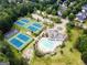 Aerial view of the community amenities including tennis courts, swimming pool, clubhouse, playground and parking at 790 Riverwood Pass, Dallas, GA 30157