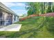 Level backyard with a nice wooden fence and a screened porch on the house at 790 Riverwood Pass, Dallas, GA 30157