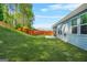 Backyard features a grassy lawn, wooden fence, and enclosed screened porch at 790 Riverwood Pass, Dallas, GA 30157