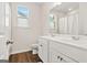 Bright bathroom featuring a double vanity, complemented by neutral tones and providing ample natural light at 790 Riverwood Pass, Dallas, GA 30157